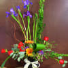 Iris, roses, gerbera daisies are a beautiful combination to send for any