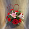 Sweet mix of Carnations, Roses and Lilies with a charming heart accent.
Lily