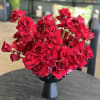 A modern, impactful arrangement of reflexed red Roses for a dramatic statement