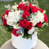 Elegance meets passion in this luxurious floral arrangement featuring bold red roses