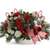 Sweet candy cane centerpiece with christmas greens, and a mix of red