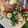 An assorted mix of blooms in a soft &amp; romantic color palette.
