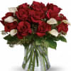 Luscious Red roses and white calla lilies in a vase
