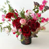 A gorgeous gathering of deep red roses with touches of Italian Pink