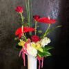 Inspiration in a vase! Heart-shaped Anthurium blooms sway along with deep red