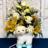 A beautiful mixture of white &amp; yellow flowers arranged in a keepsake
