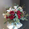 Cymbidium orchids and roses? A match made in heaven this Valentine's Day.