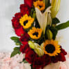 Roses with lilies and sunflowers, an arrangement for birthdays or any special