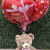 This cute Valentine's bear comes with 5 assorted Valentine's balloons.  
