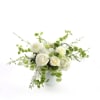 This is an all white and green flower arrangement in a large