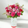 Brighten someone's day with this dazzling medley of pinks and reds. Featuring