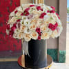 Brighten any space with our Elegant Flower Box Arrangement! Bursting with vibrant