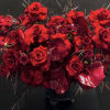 THIS ELEGANT DESIGN SHOWCASES THE BEAUTY OF VELVETY DEEP RED ROSES, STRIKING