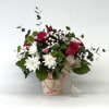 The Sweetheart Garden Vase is a cheerful and romantic floral arrangement designed