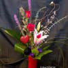 Designed in a ceramic heart shaped vase this
bouquet features a stargazer lily