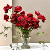 Overflowing with elegance and drama, this taller arrangement features an abundant collection