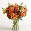 Our delightfully vibrant bouquet is filled with a medley of blooms in