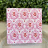 Valentines enclosure card featuring red roses and hearts with pink detail. A