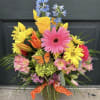 Beautiful blooms create this gorgeous vase arrangement to brightens anyone&rsquo;s day.
