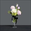 Stunning glass vase filled with Ranunculus, tulips, rose, and green hydrangea.
Approximate size