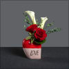 Perfect for a Valentine! Ceramic vase with roses and miniature calla lilies.
Approximate