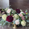 This arrangement is uniquely crafted with elegant moody vibes. Florals may vary