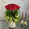 Dozens of Long Stem Red roses accompanied with Tropical Imported Orchids and