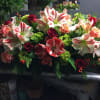 A long and low mix of Amaryllis and roses 