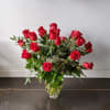 Our signature rose arrangement featuring beautiful premium roses accented by lush greenery