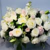  A beautiful arrangement of soft pink, white ease the burden of