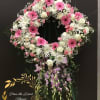 This beautiful standing diamond sharp arrangement, make with White roses, spider mum