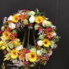 This beautiful wreath made roses, carnations, lilies, daisy  and gebera