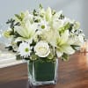 Arrangement of white roses, Asiatic lilies, football mums, snapdragon, daisy poms and