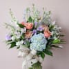 a cool mix of lavender, blue and peach florals in a tall