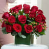 24 premium red roses arranged in a clear 5x5 cube vase 