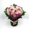 A romantic mix of pink, lavender, and white roses arranged in a