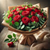 24 red roses wrapped in a bouquet including greens and filler.