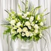 Beautiful display of white flowers-roses, hydrangea, lisianthus, carnations, gladiolus gracefully arranged in