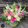  Bright and abundant arrangement designed in a high-quality green vase