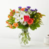 Reminiscent of a warm sunny day, the colorful hues of this arrangement