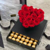 A bold heart-shaped arrangement of premium red preserved roses in a sleek