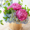Golden Peony Grace is a refined floral arrangement featuring three premium peonies