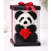 A charming panda handcrafted entirely from delicate foam roses in classic black