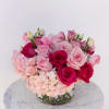 A dreamy mix of soft blush and vibrant pink blooms designed to