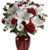 Add some romance with this rich arrangement of luxurious flowers in classic