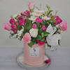 Pretty in Pink hat box arrangement filled to the brim with vibrant