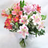 A beautiful mix of long-lasting alstromeria arranged with Babies Breath and greens