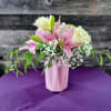 Lovely pink lilies and white roses in a cut glass vase. (Color