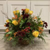 Beautiful fall flowers accented by berries and fall foliage.