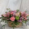 Lovely combination of pink lilies, carnations, roses, and stock with greens in